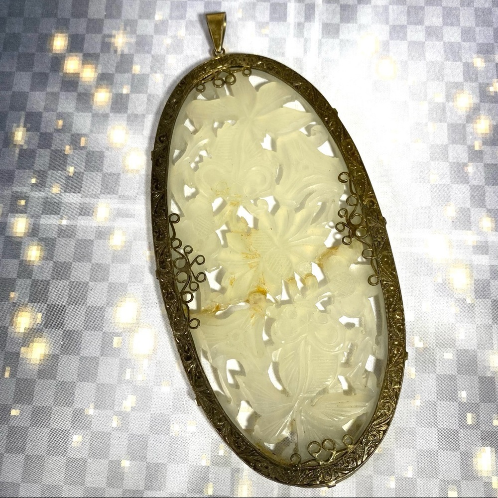 Beautiful hand carved jade pendant with flowers and koi set in Sterling silver